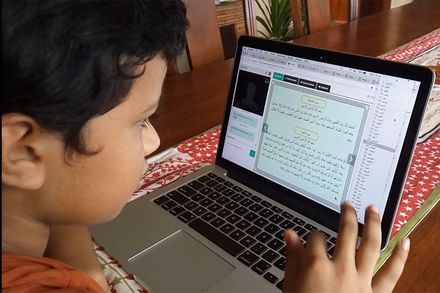 Student joining an online Quran class from home